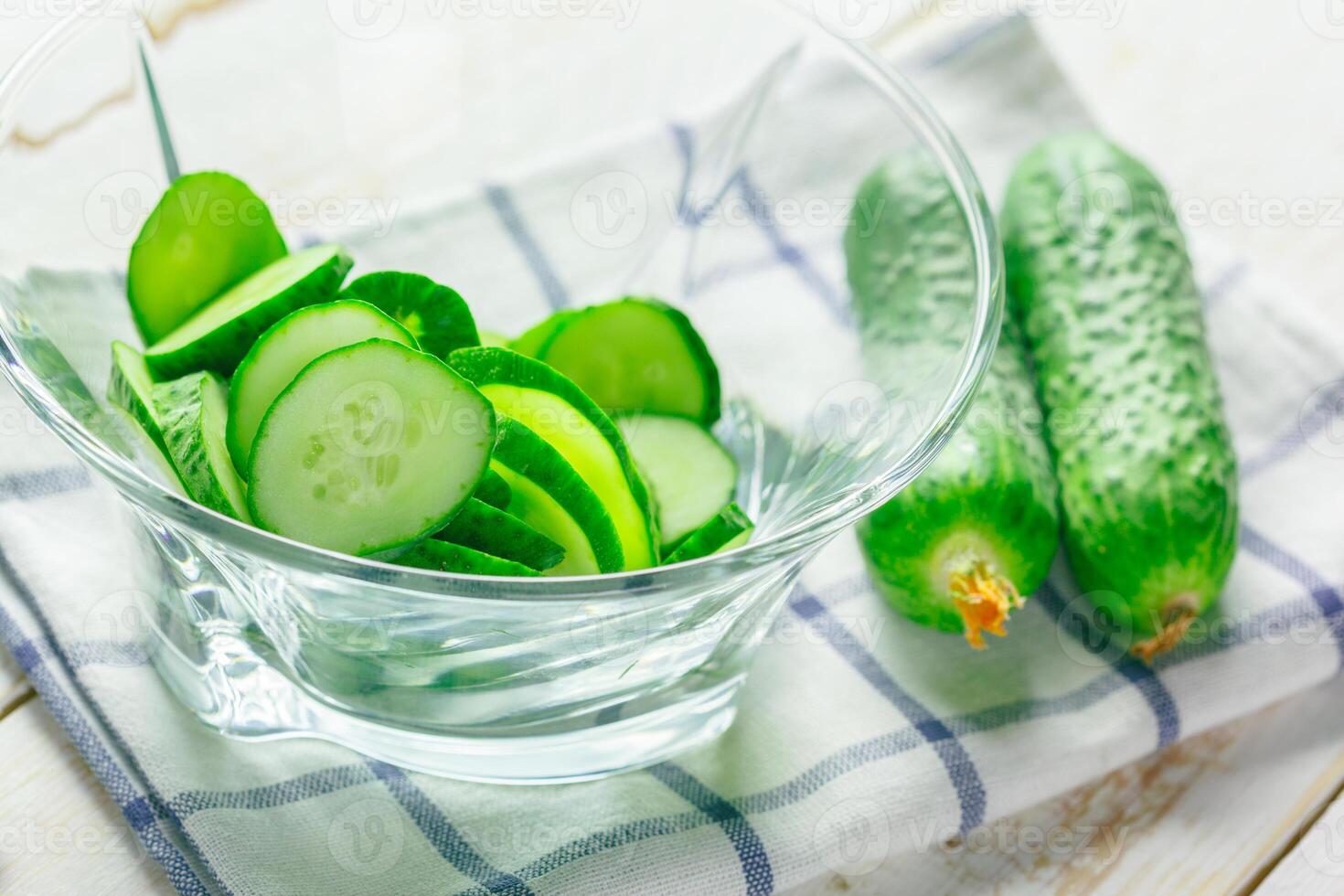 cucumbers on wooden background photo