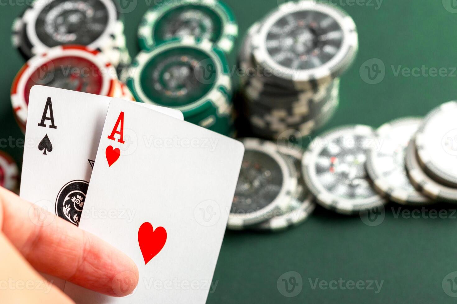 Cards and chips for poker on green table photo
