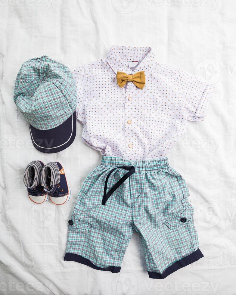 Baby boy clothes on white background photo