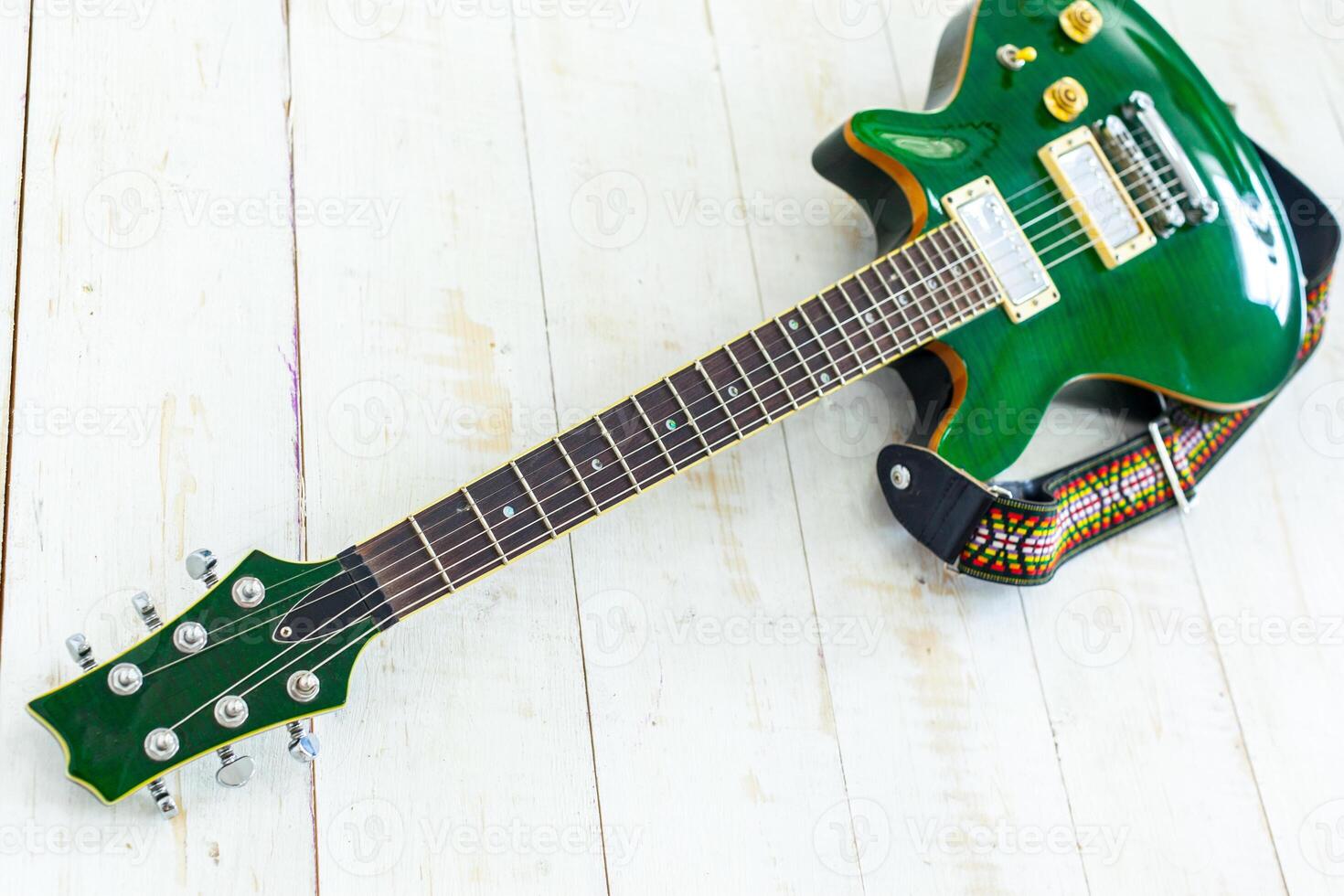 Electric guitar on old wooden surface photo