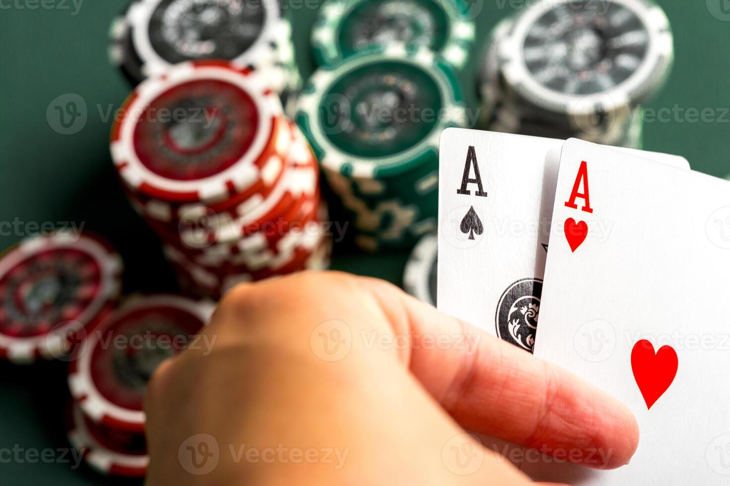 Cards and chips for poker on green table photo