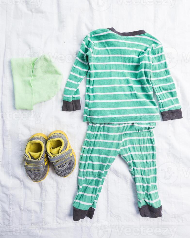 Baby boy clothes on white background photo