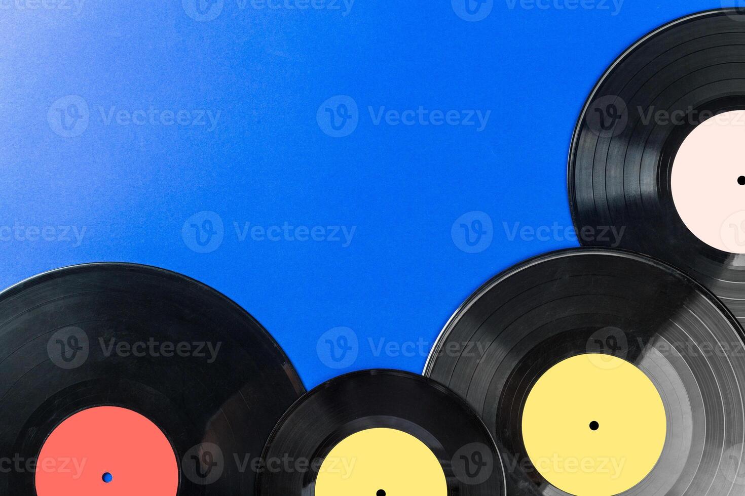 Retro vinyl record on blue background photo