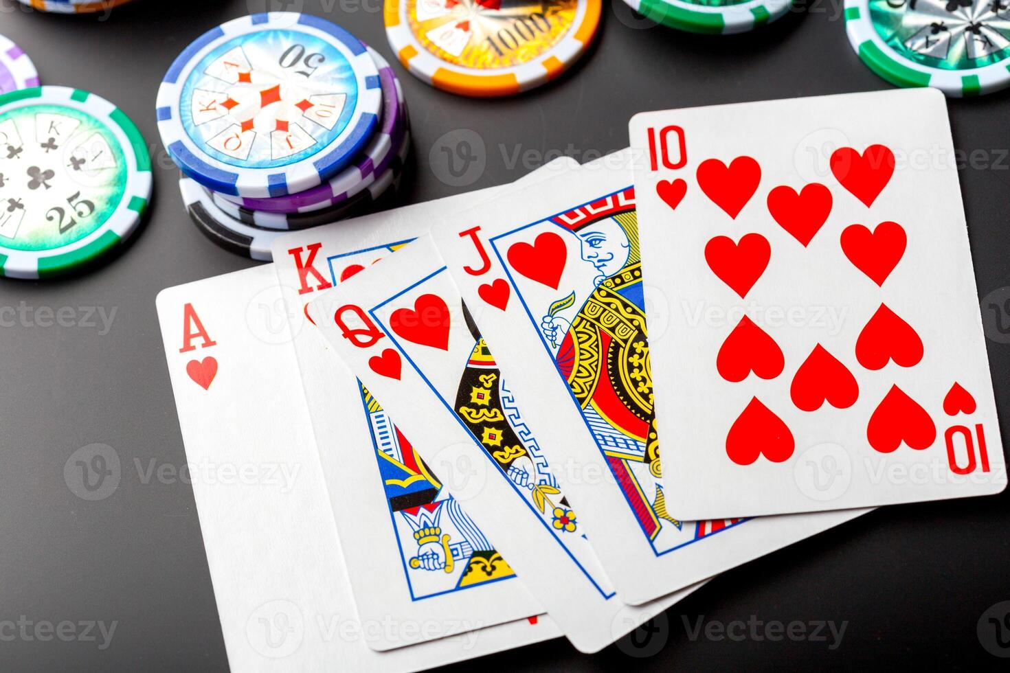 poker chips and cards on black background photo