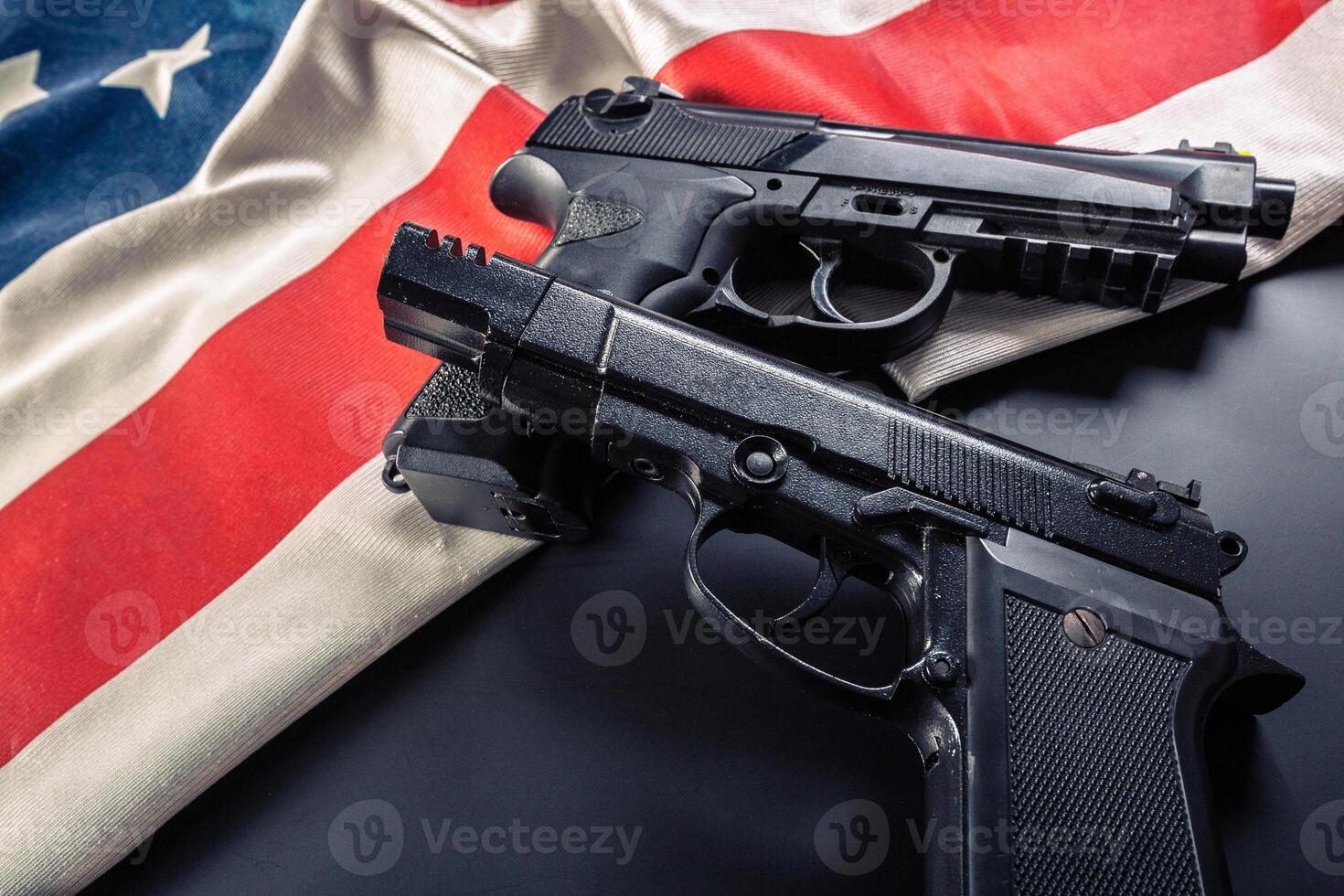 Handgun lying on American flag photo