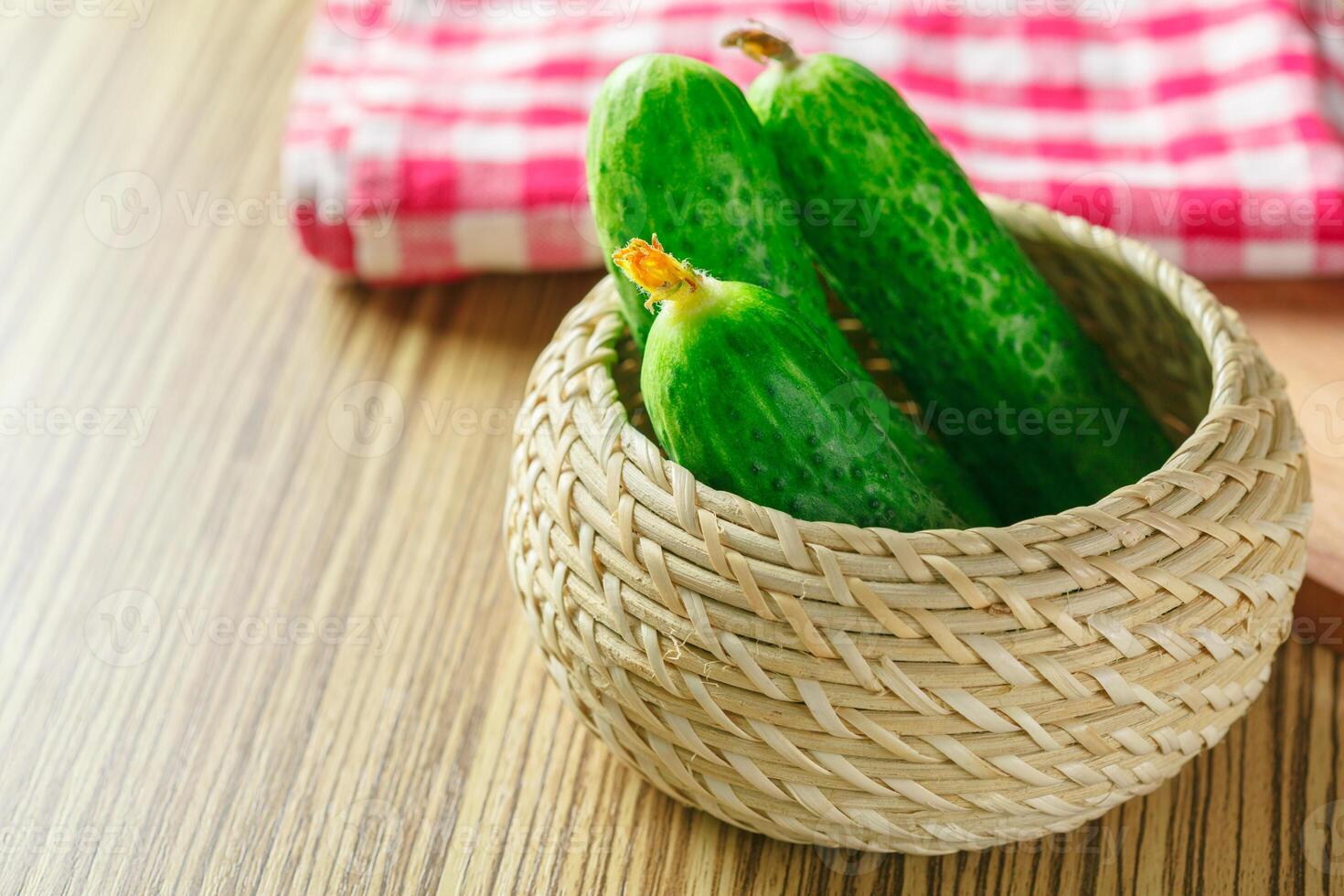 cucumbers on wooden background photo