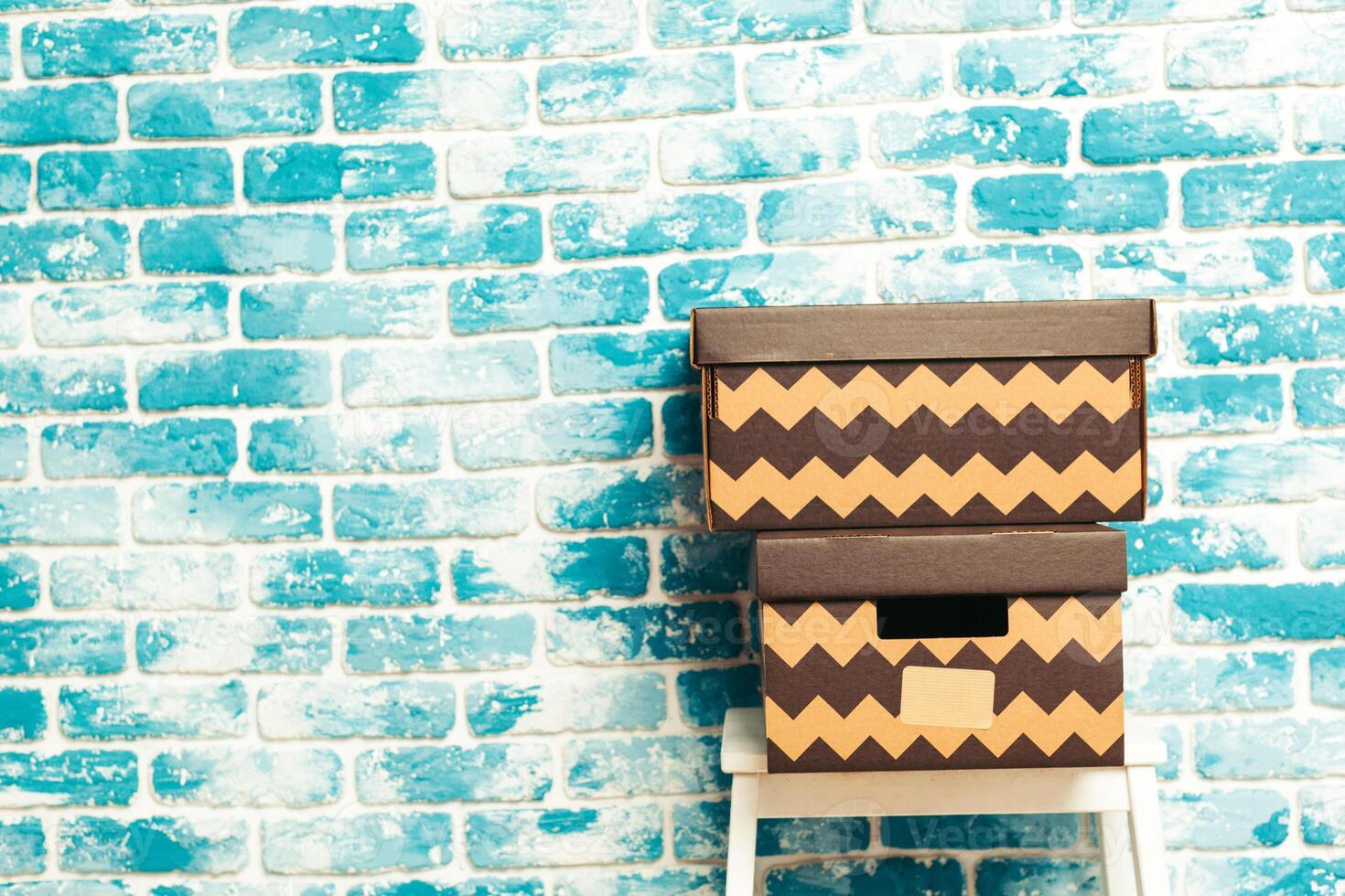 Big cardboard boxes standing insinde a room photo