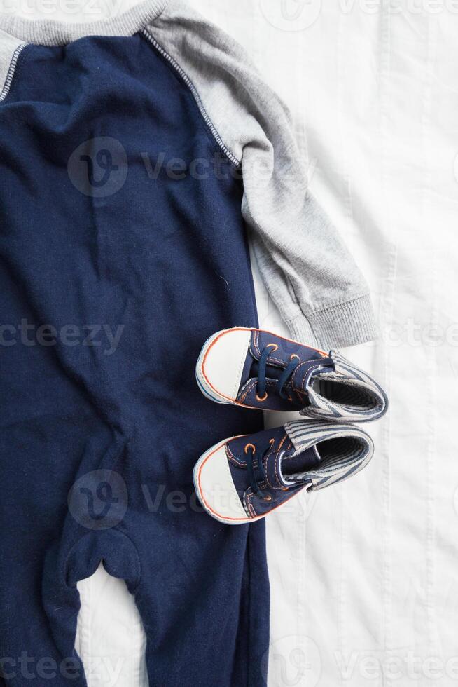 Baby boy clothes on white background photo