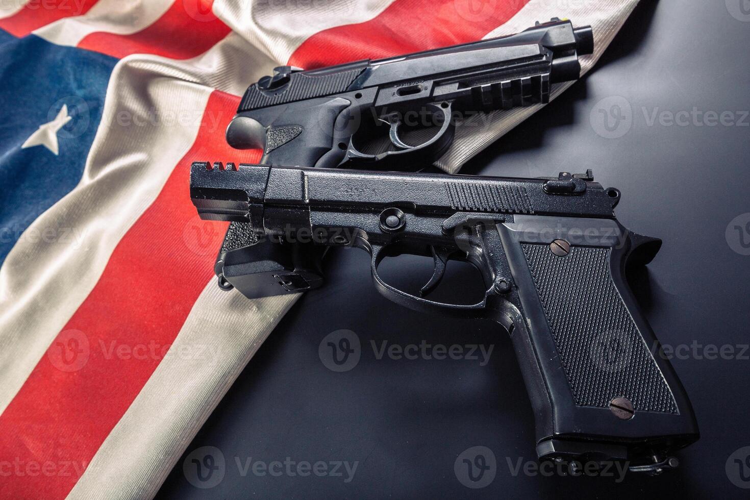 Handgun lying on American flag photo