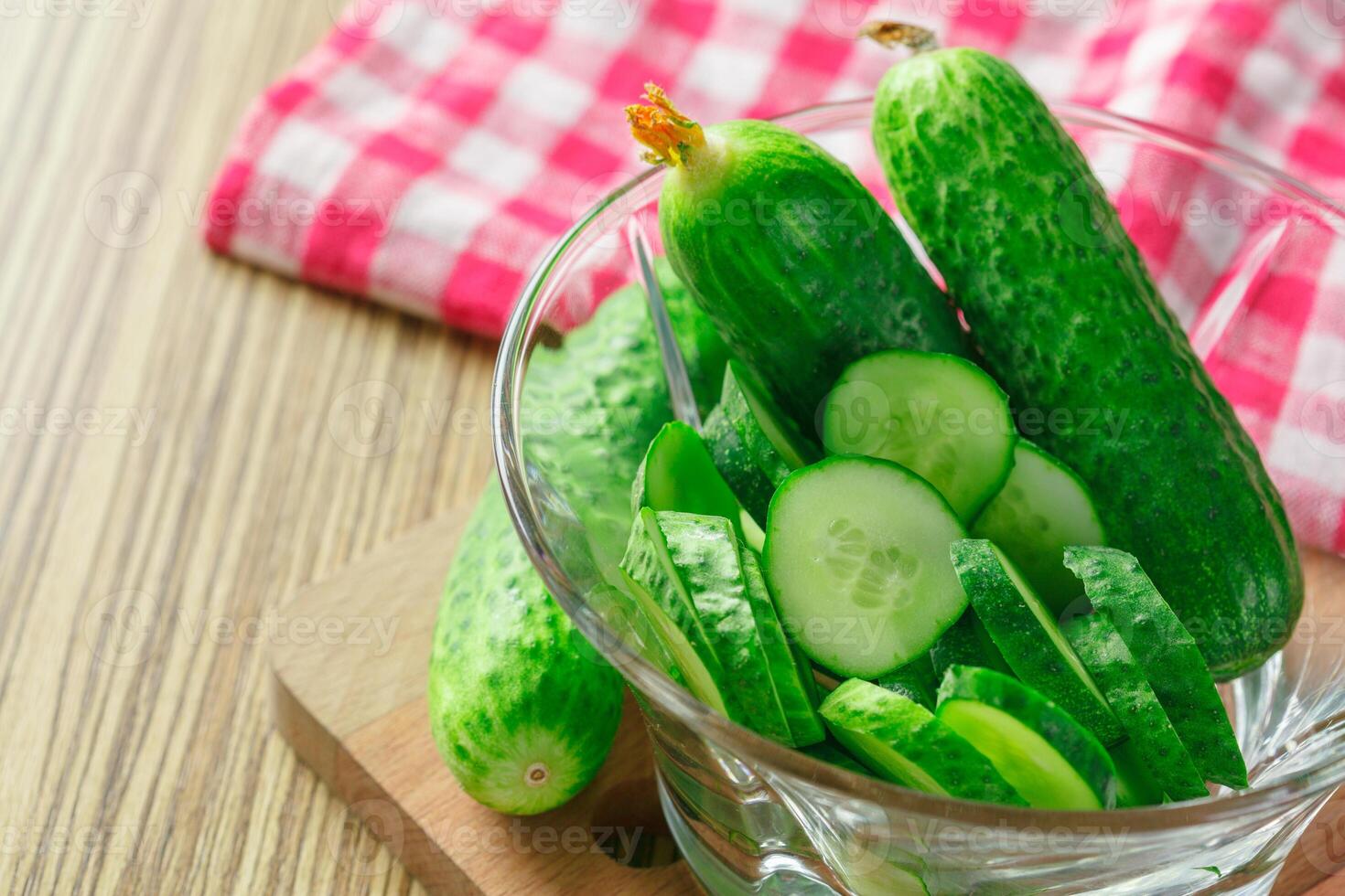 cucumbers on wooden background photo