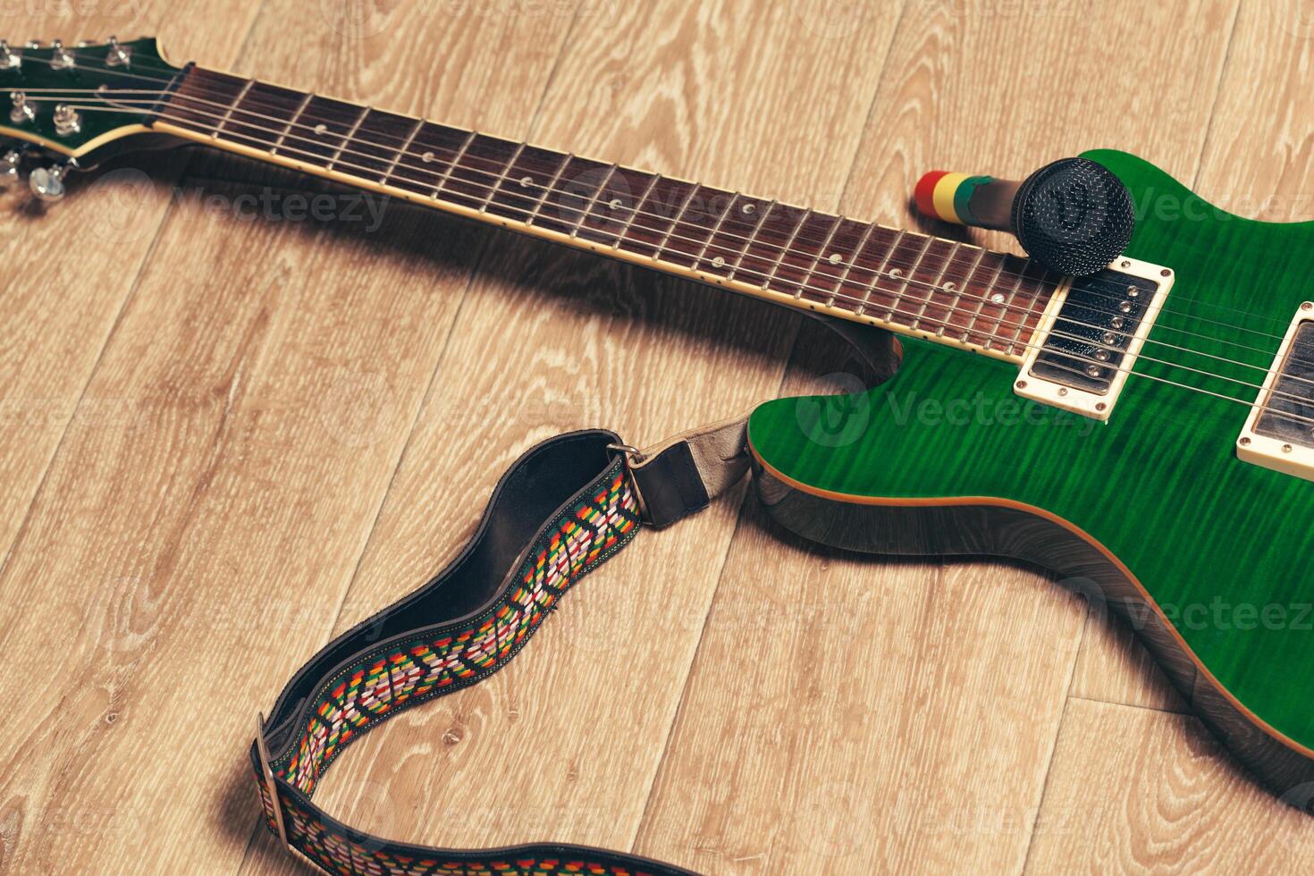 Electric guitar body and neck detail on wooden background photo