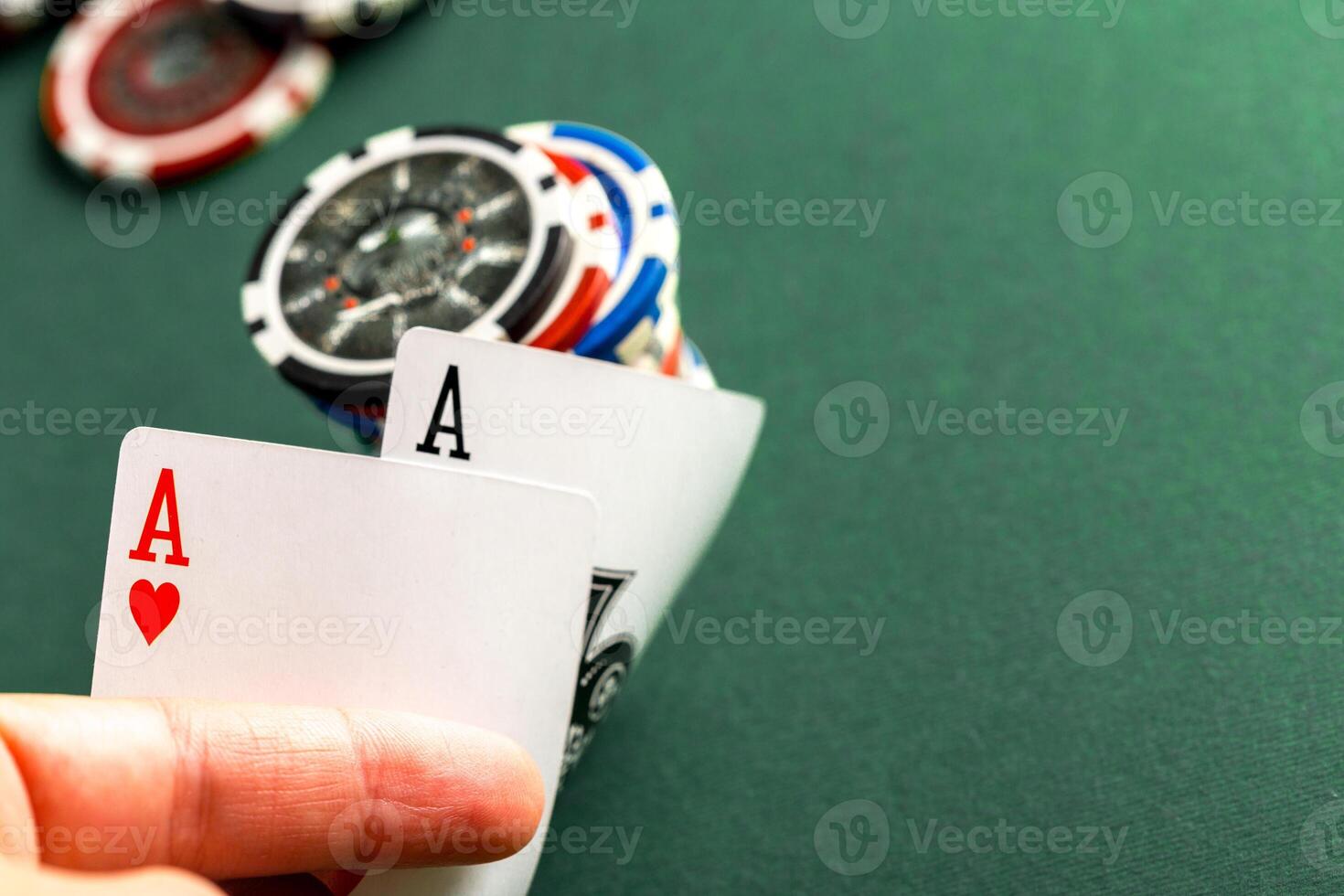 Cards and chips for poker on green table photo