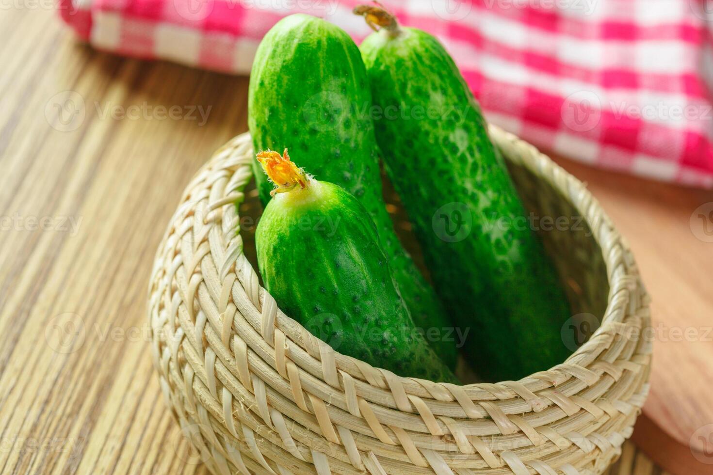 cucumbers on wooden background photo