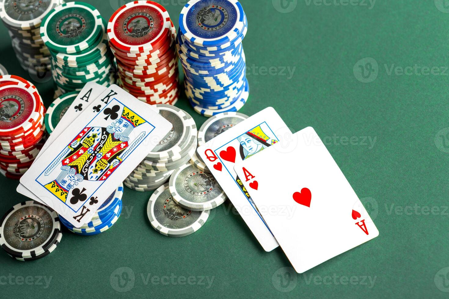 Cards and chips for poker on green table photo