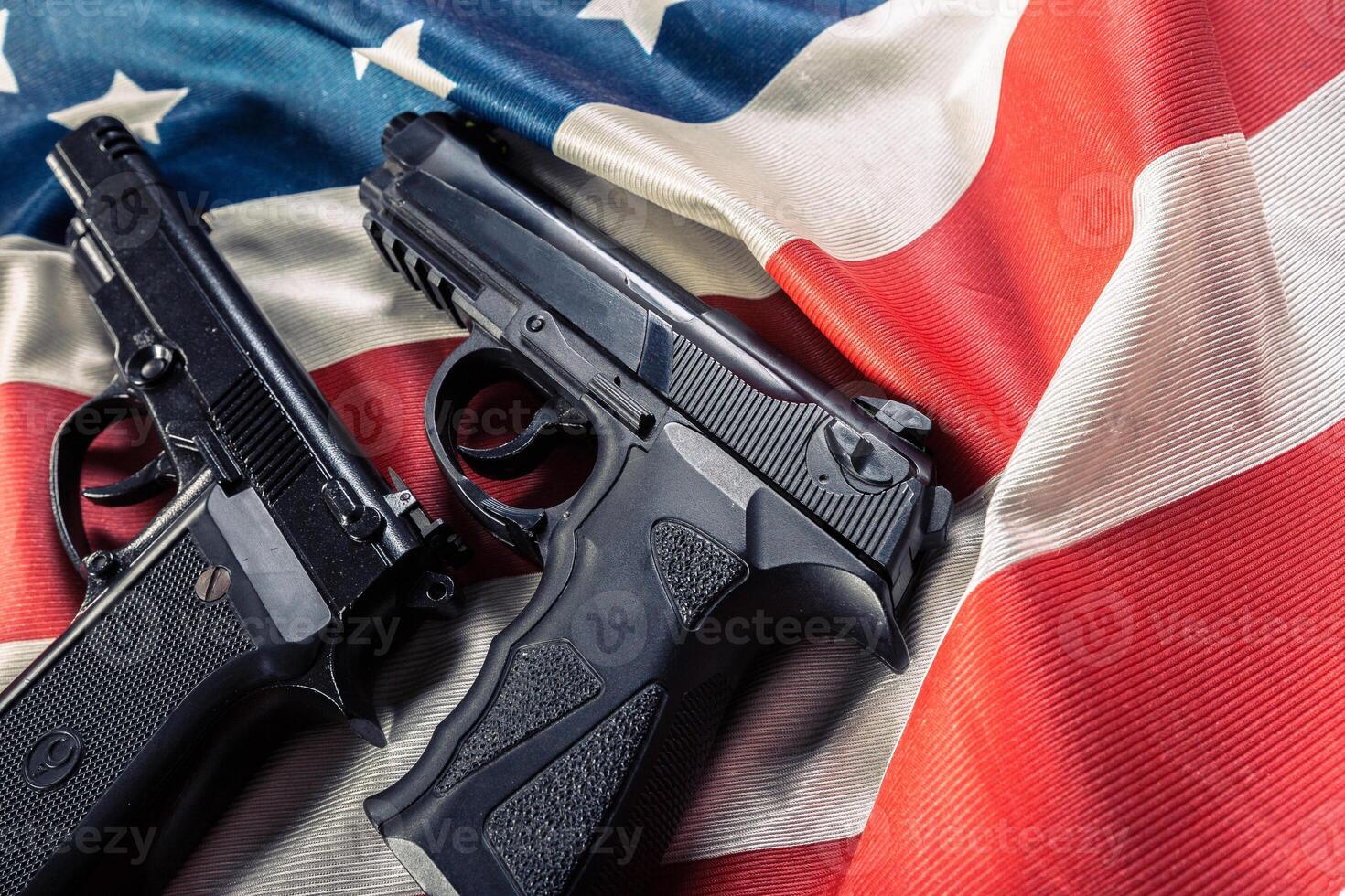 Handgun lying on American flag photo