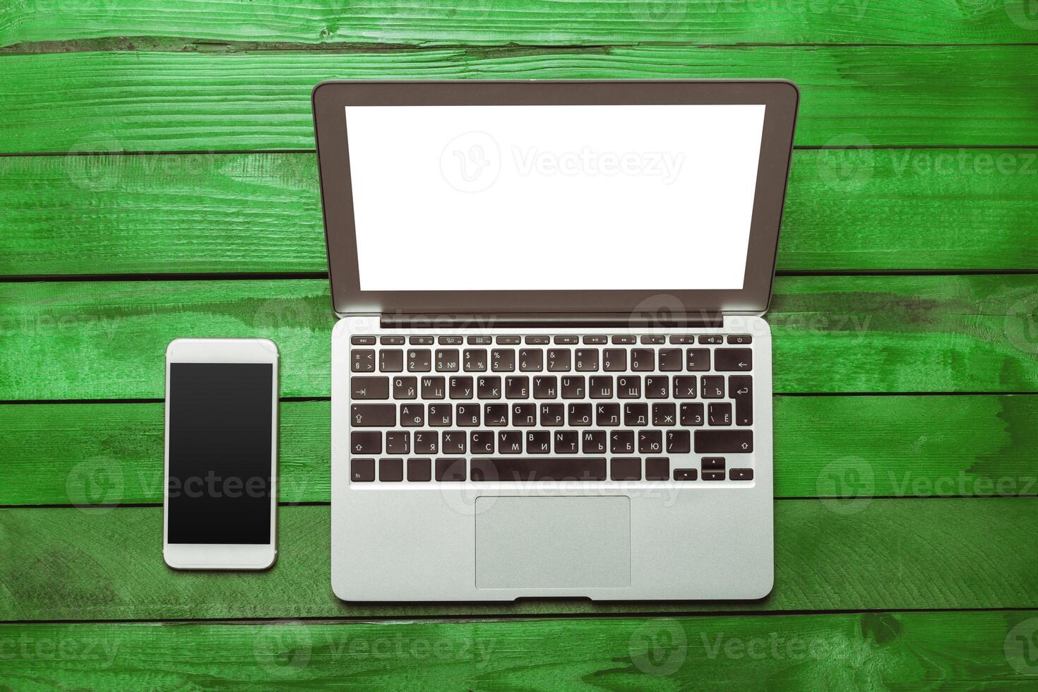 Office table with smartphone on it. View from above photo