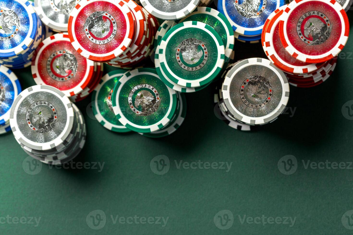 Cards and chips for poker on green table photo