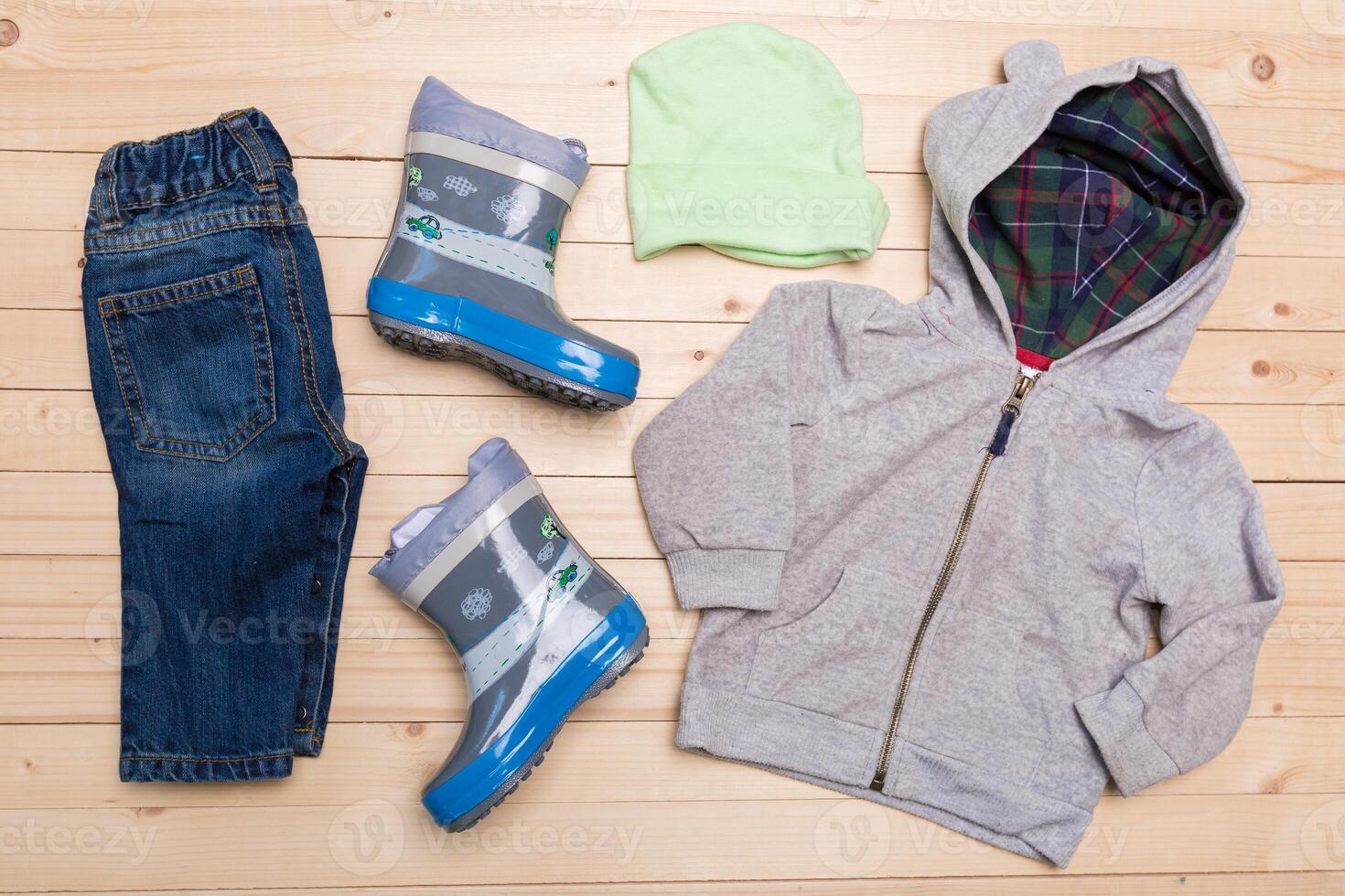 baby clothes for boys on wooden background photo