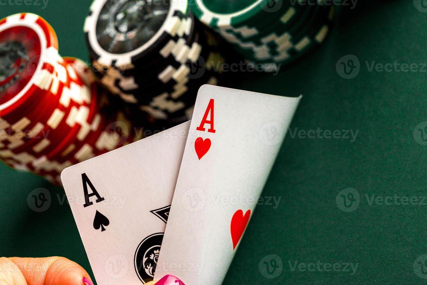 Cards and chips for poker on green table photo