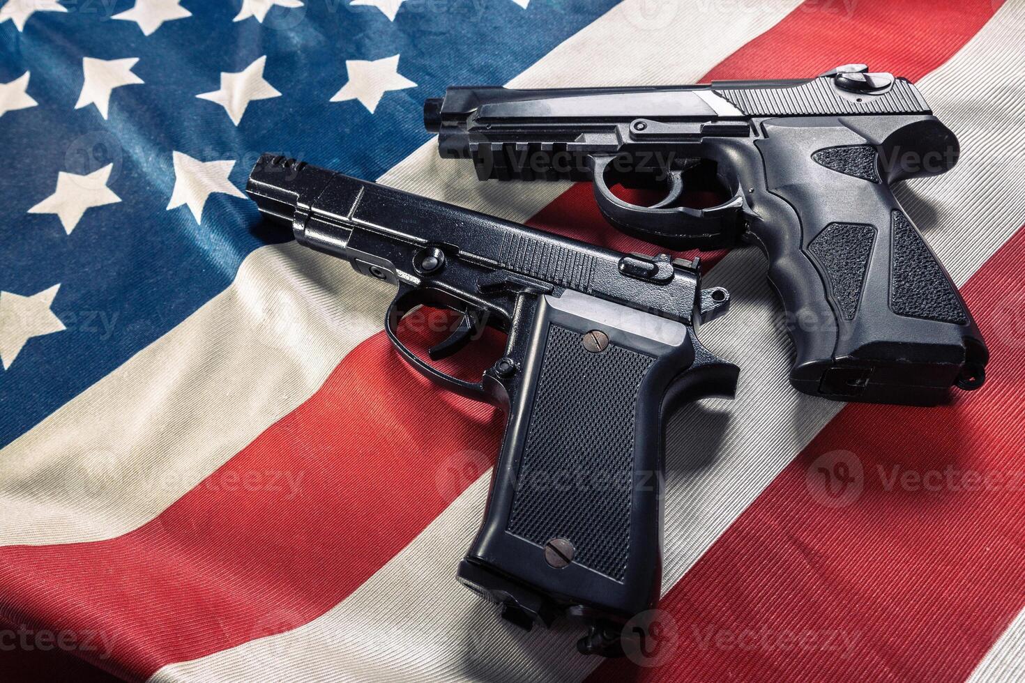 Handgun lying on American flag photo