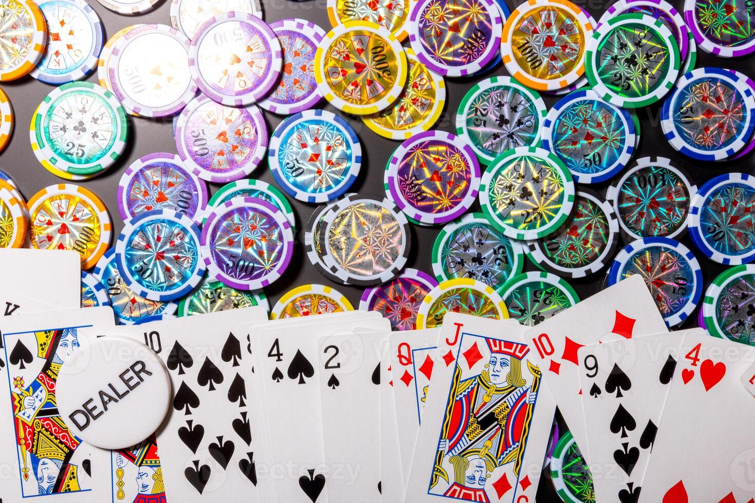 poker chips and cards on black background photo