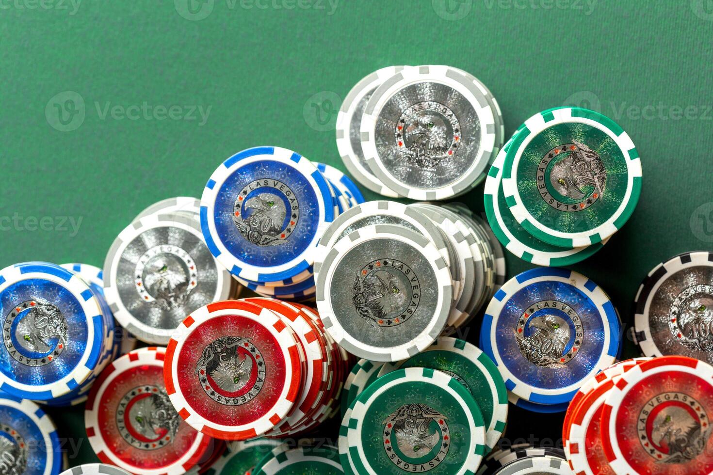 Cards and chips for poker on green table photo