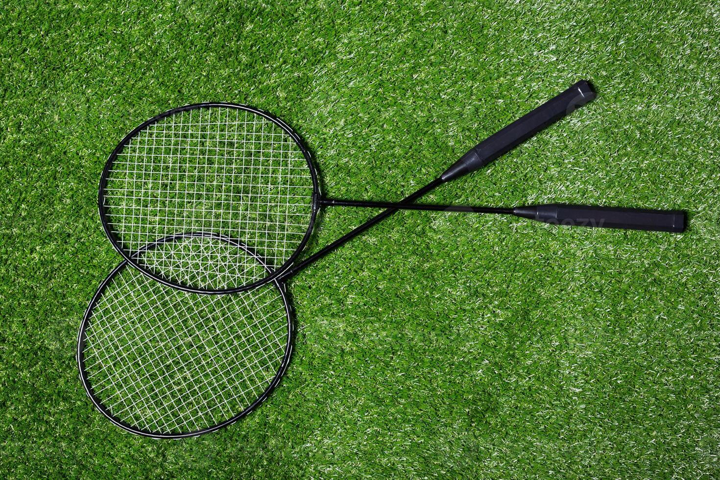 badminton racket on grass photo