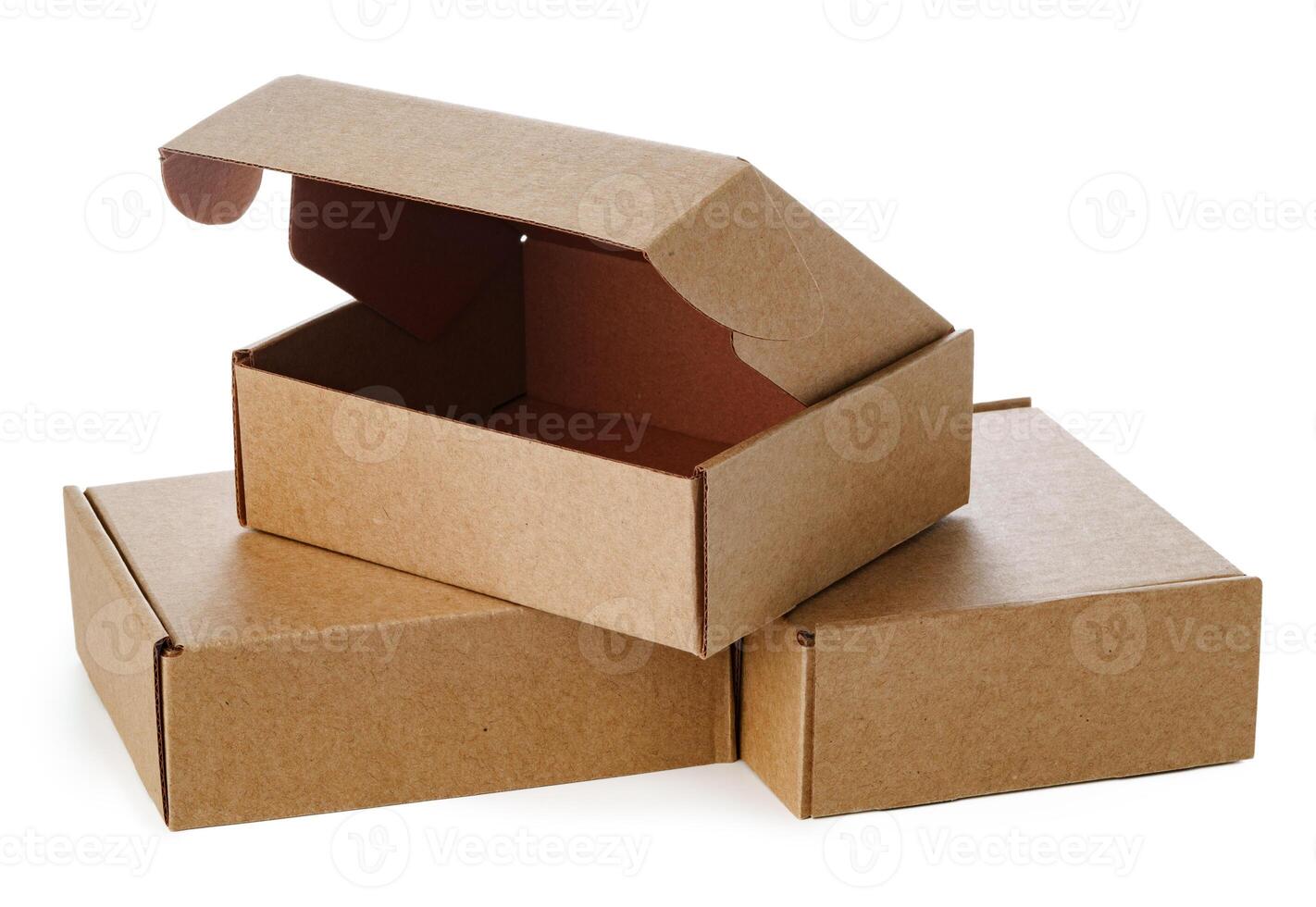 Stacked brown cardboard boxes in various sizes arranged on a white background photo