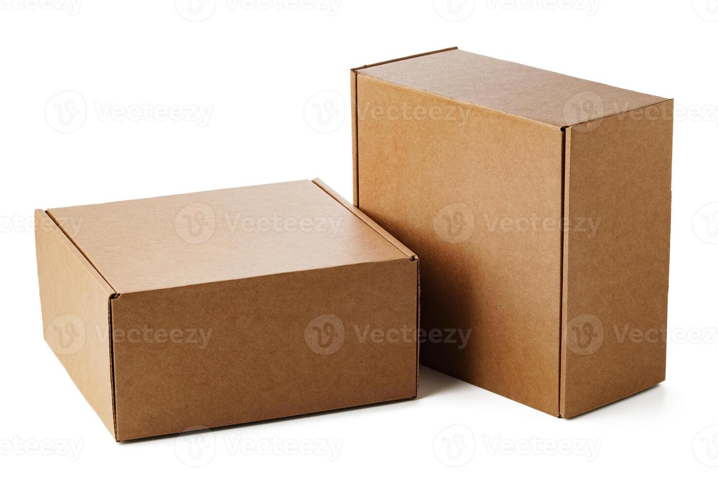 Two brown cardboard boxes stacked together on a plain surface photo