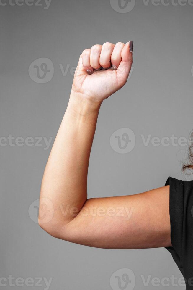 signaling a small size against a gray background photo