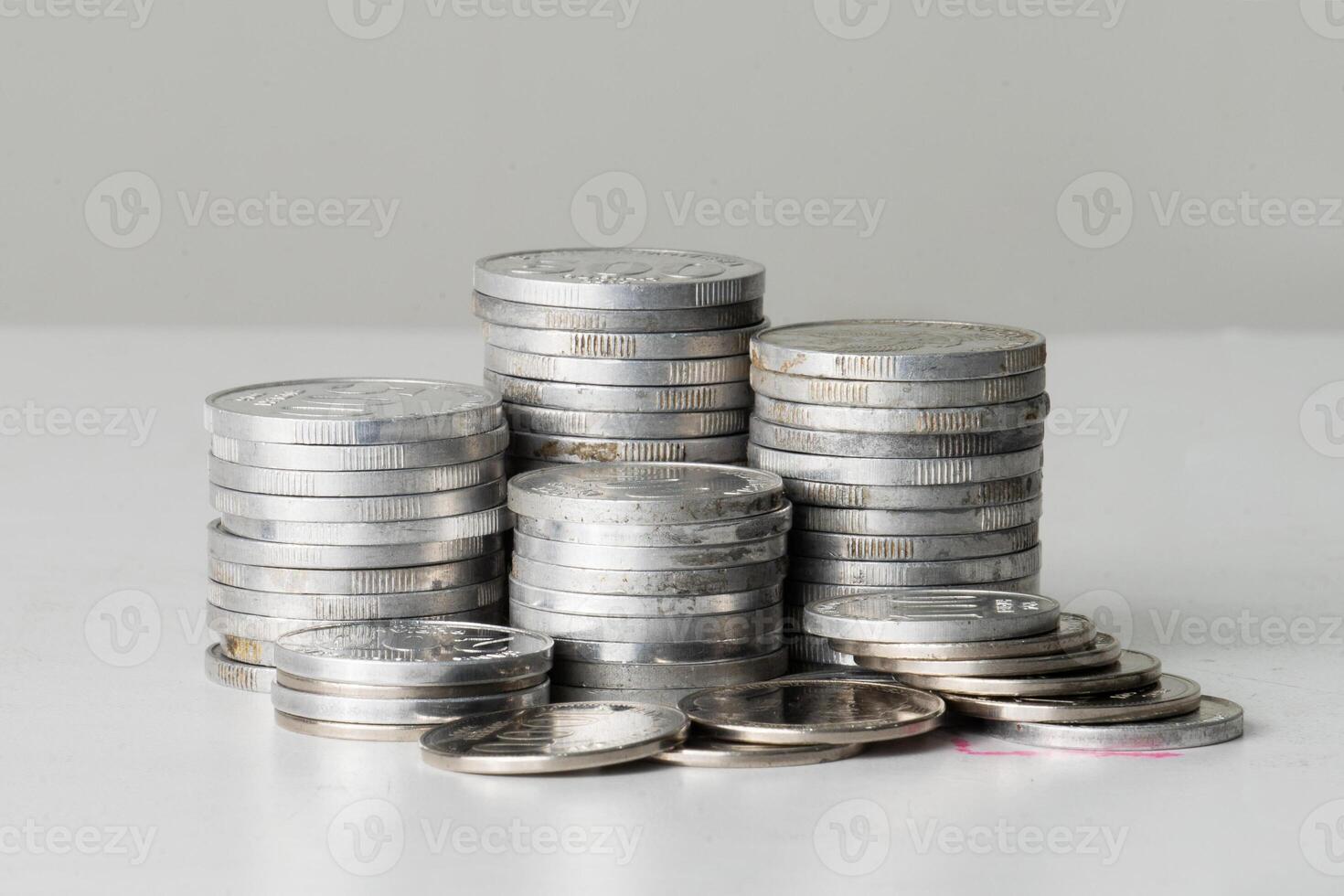 Stack of coin isolated on table photo