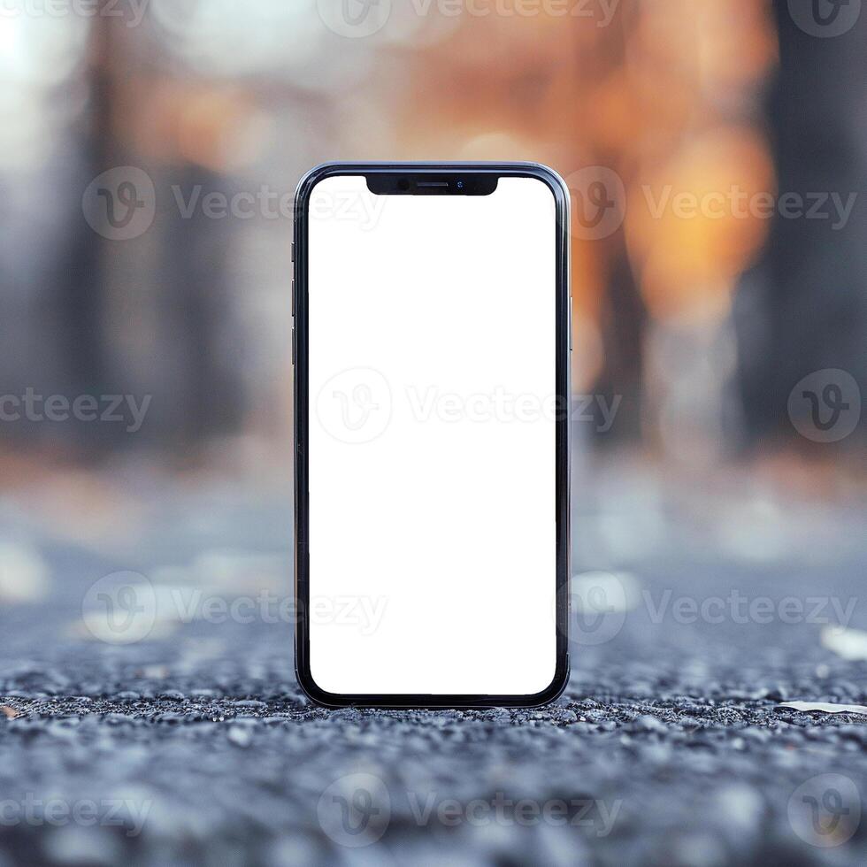 Black smartphone mockup template on asphalt or road. Front view photo