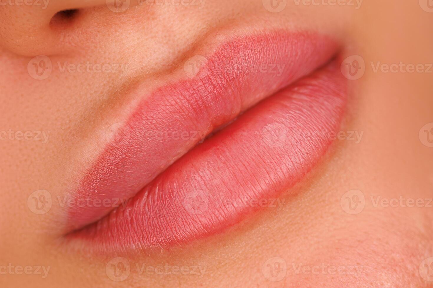A close up of lips one month after the procedure. A soft pigment enhances the lip contours giving them a natural look after healing. photo