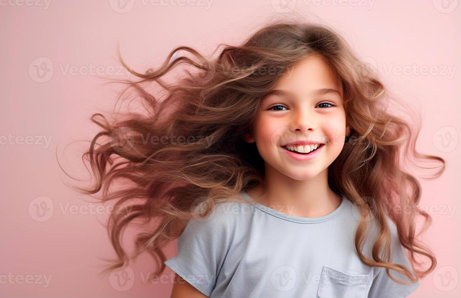 A little girl with long hair is smiling photo