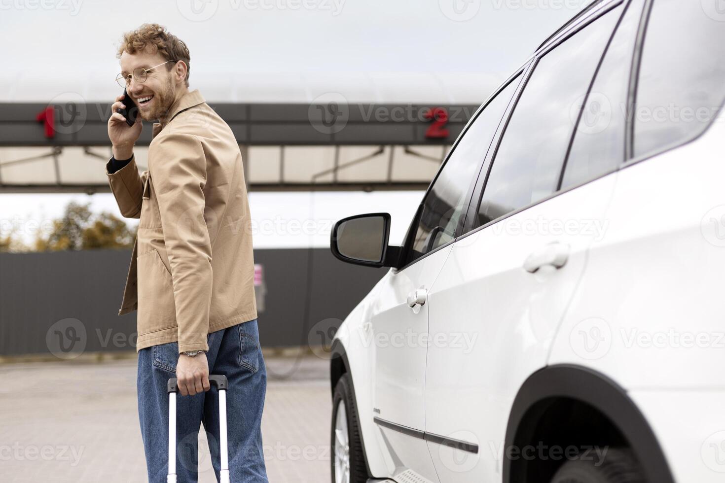 Tourist walking towards car sharing economy using smartphone photo