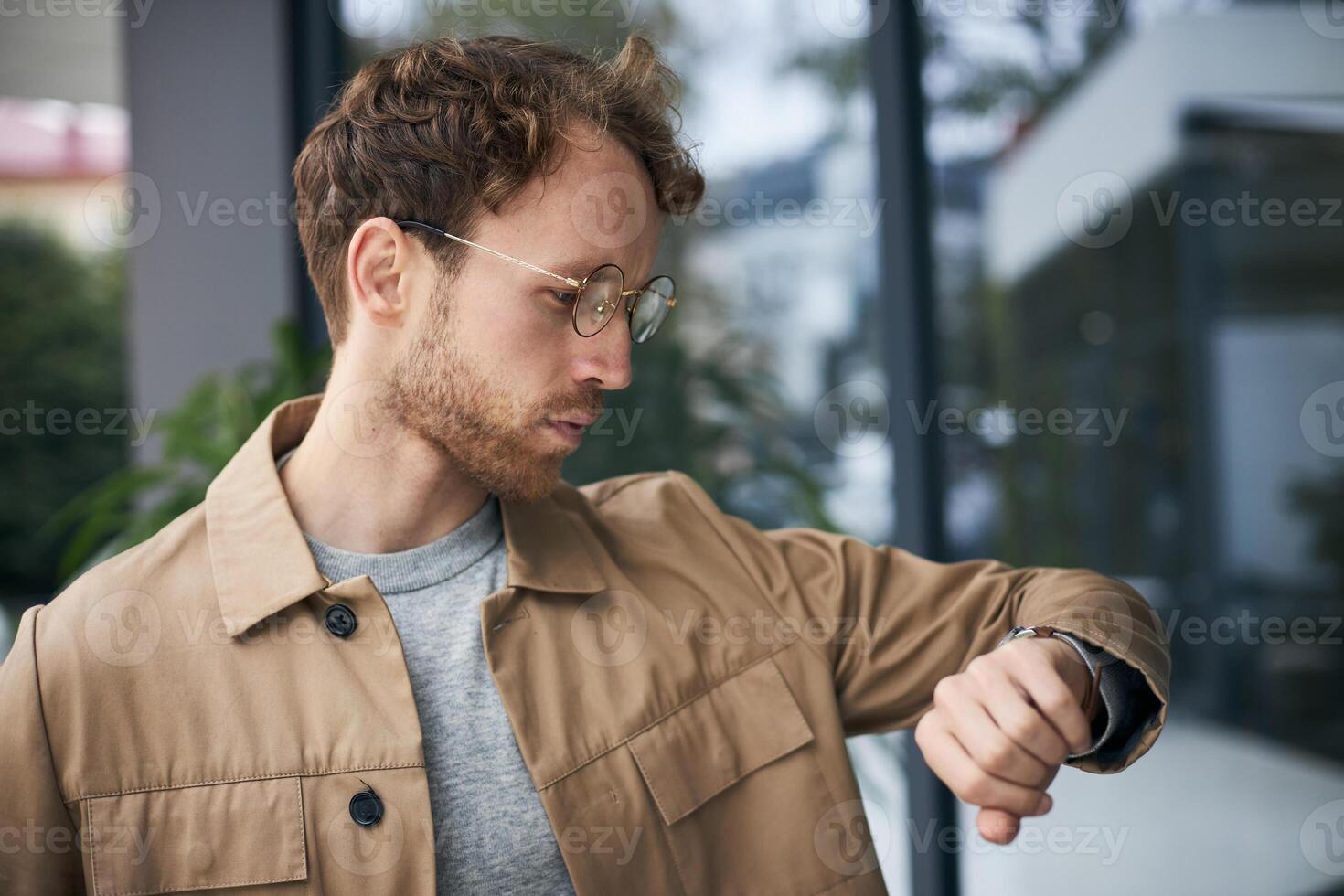 Businessman checking the time while waiting for a meeting photo