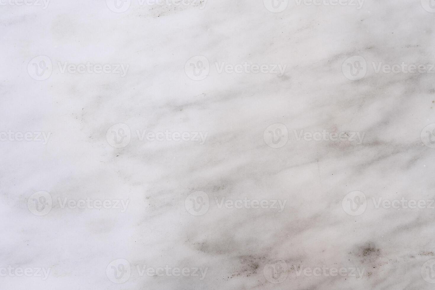White marble texture showing a subtle pattern of grey veins photo
