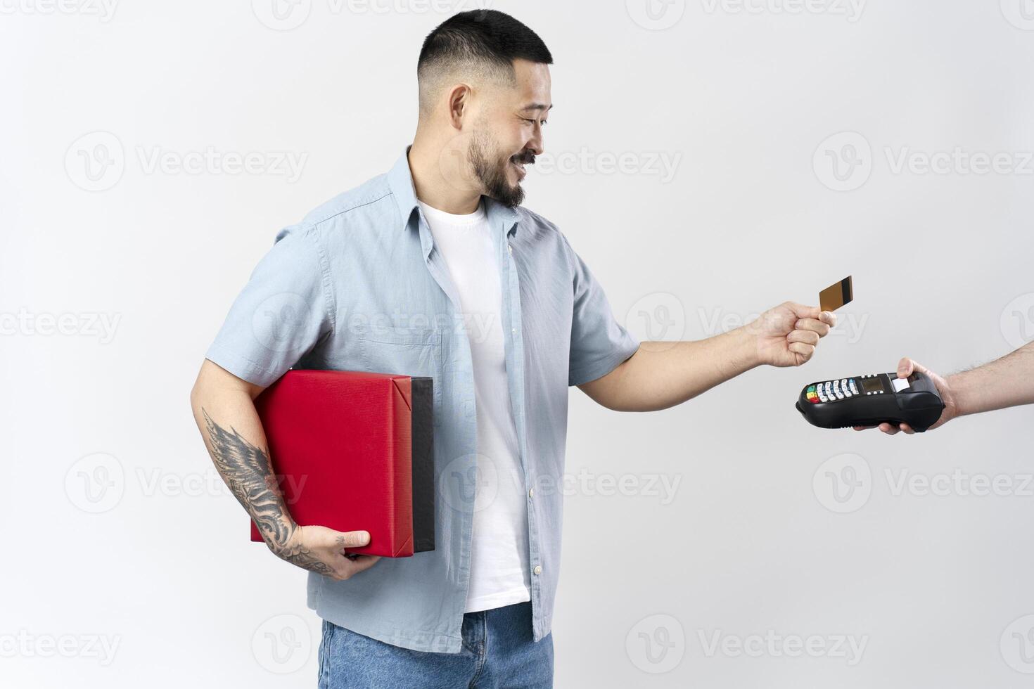 Customer holding shopping bags paying with credit card at pos terminal photo