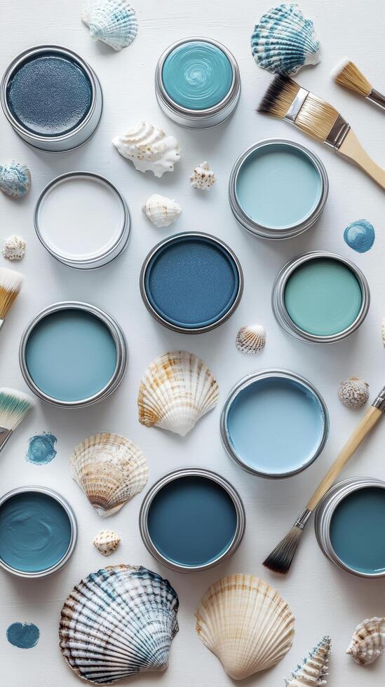 Paint cans and seashells creating a relaxing coastal palette photo