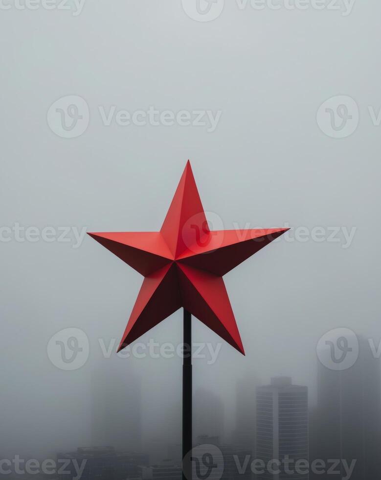 A red star on top of a building in the fog photo