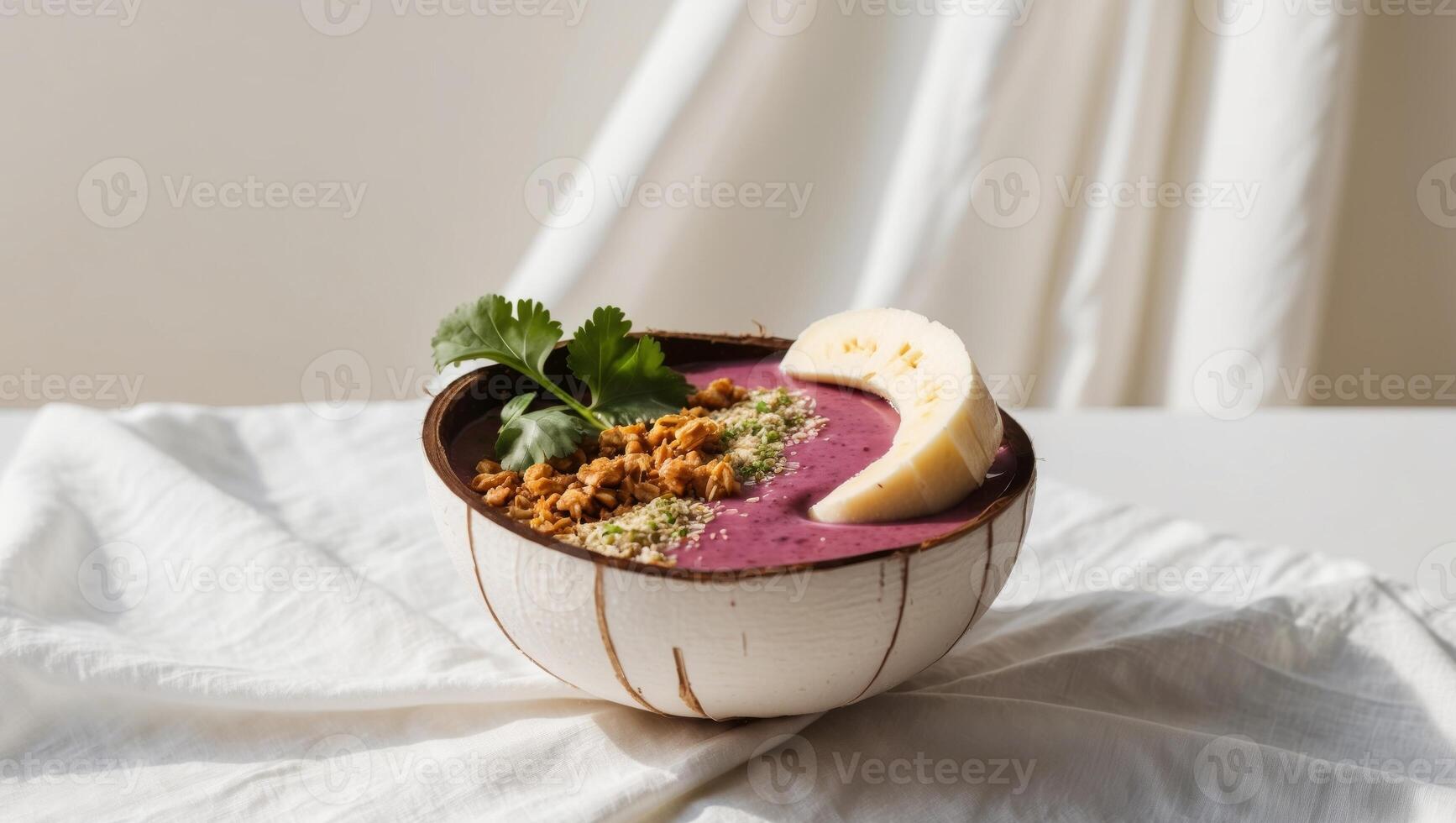 A bowl of purple smoothie with a banana and some nuts photo