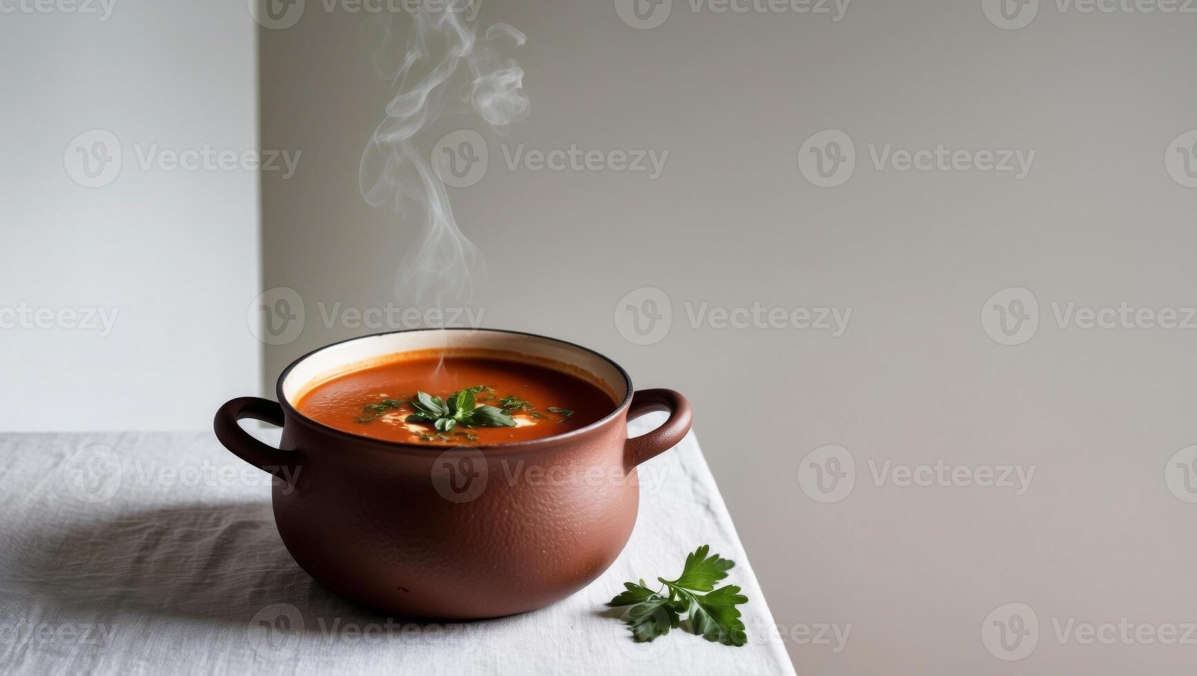 A pot of soup with a steaming bowl of soup on a table photo