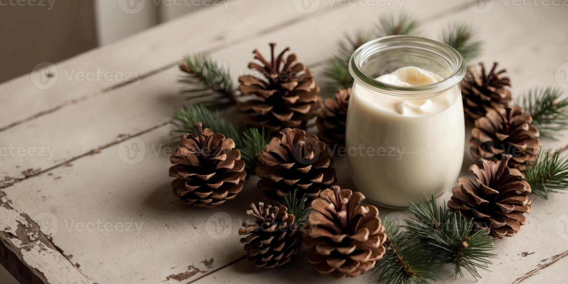 A jar of milk with pine cones and evergreen branches photo