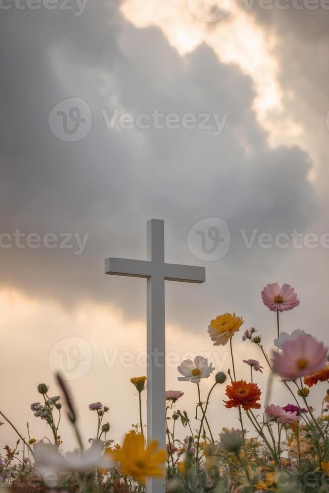 A cross in a field of flowers photo
