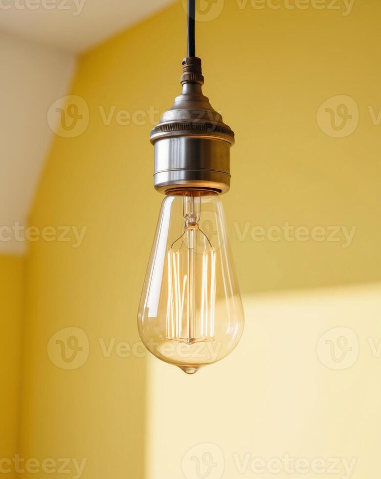 A light bulb is hanging from a ceiling photo