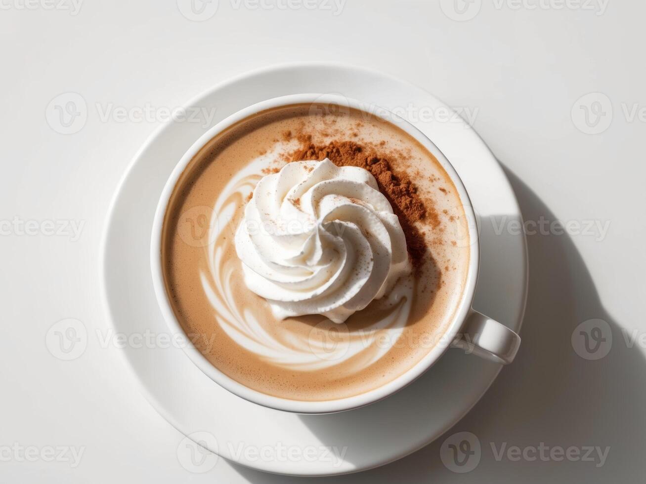 A cup of coffee with whipped cream and cinnamon photo