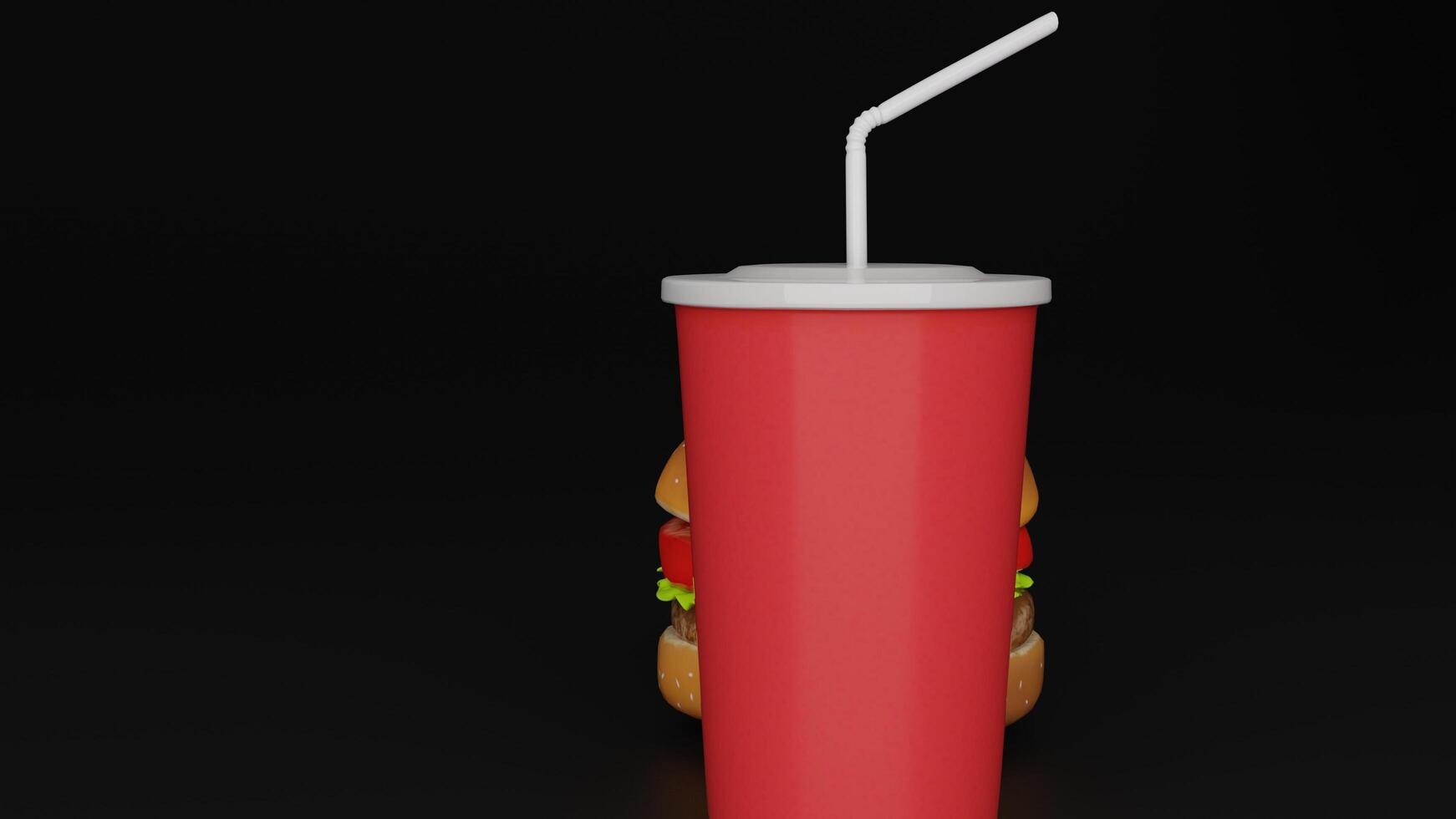 a hamburger and a red drink next to each other photo