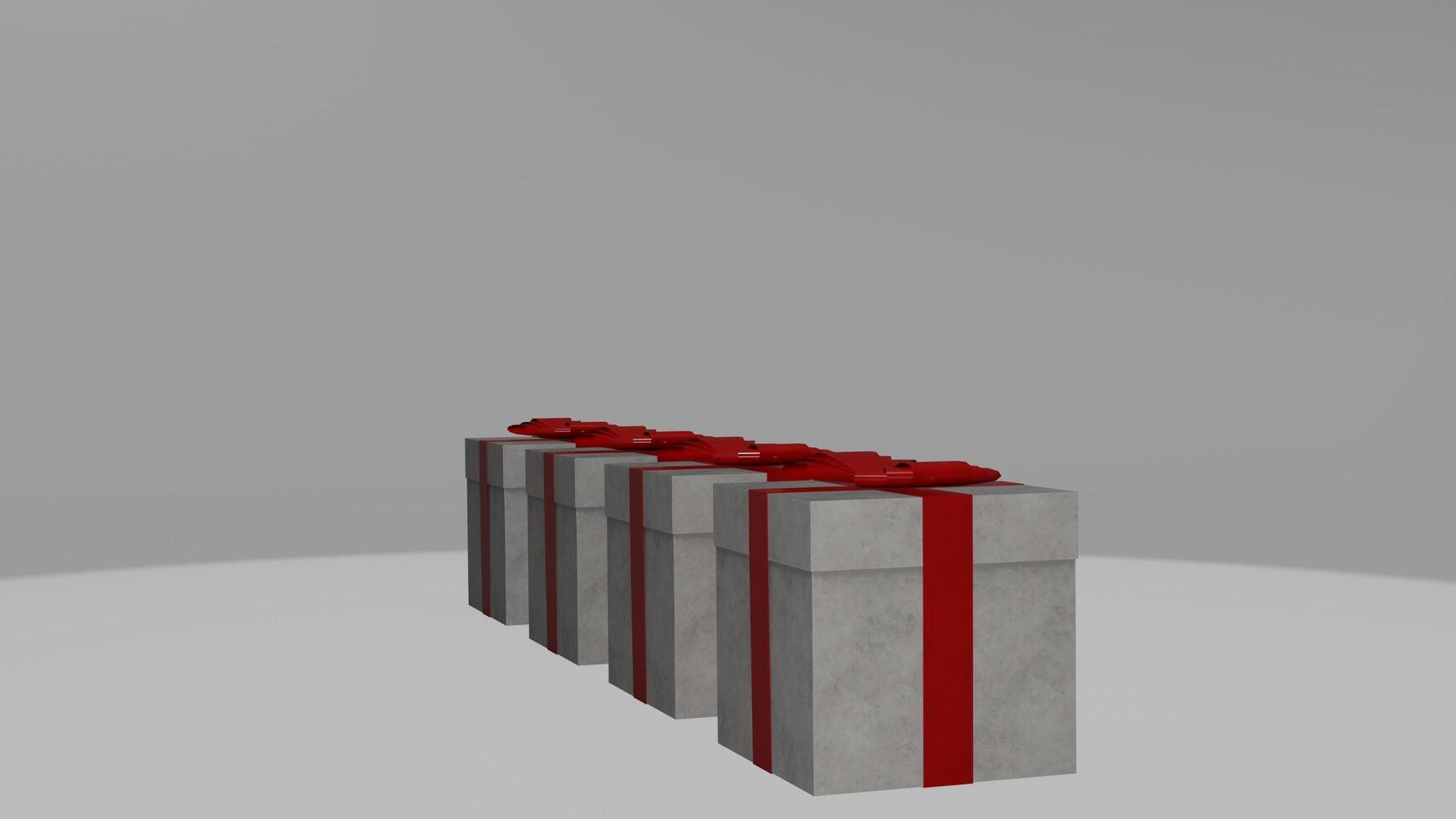 Three gift boxes with red bows on top photo