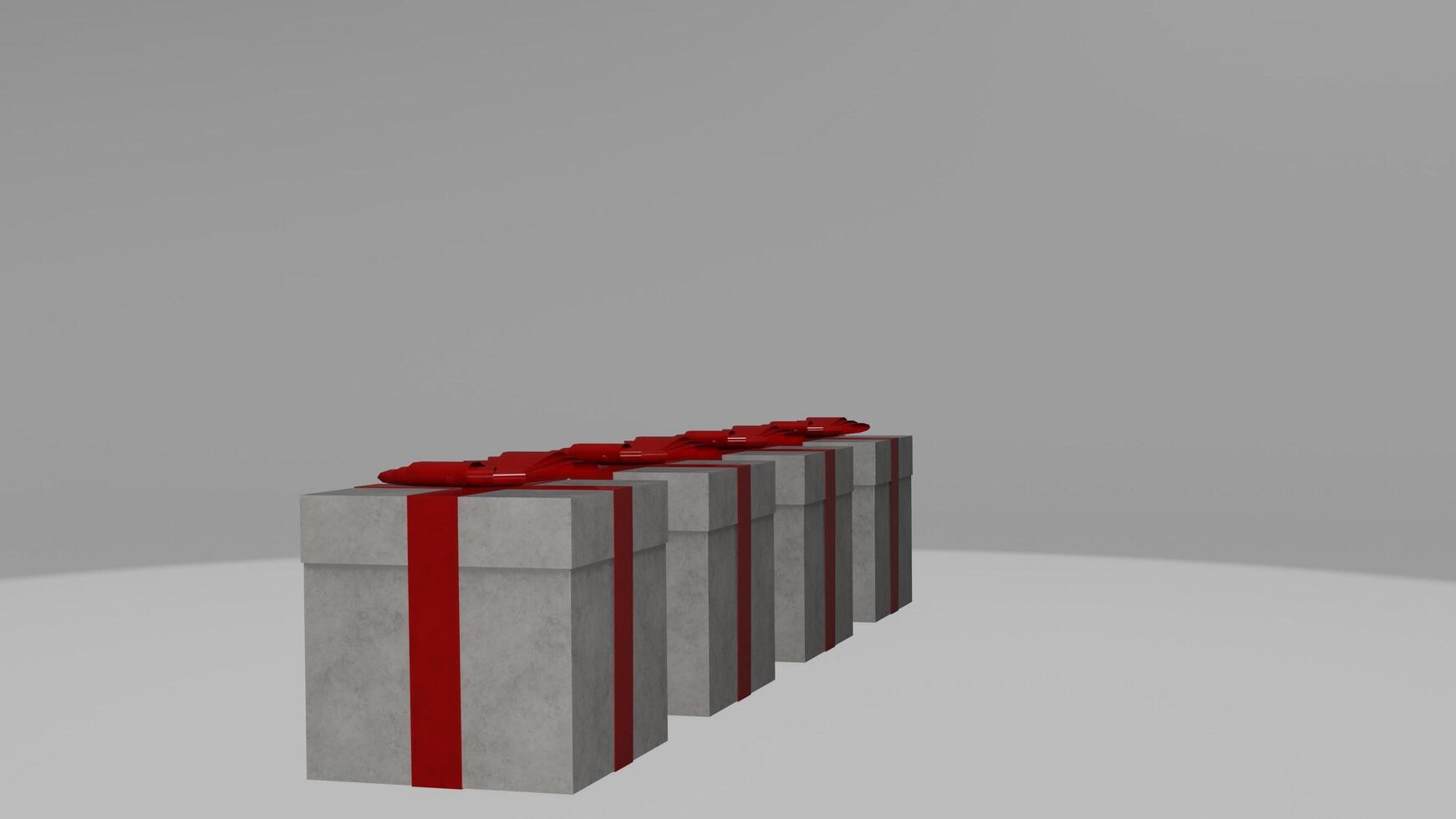 Three gift boxes with red bows on top photo