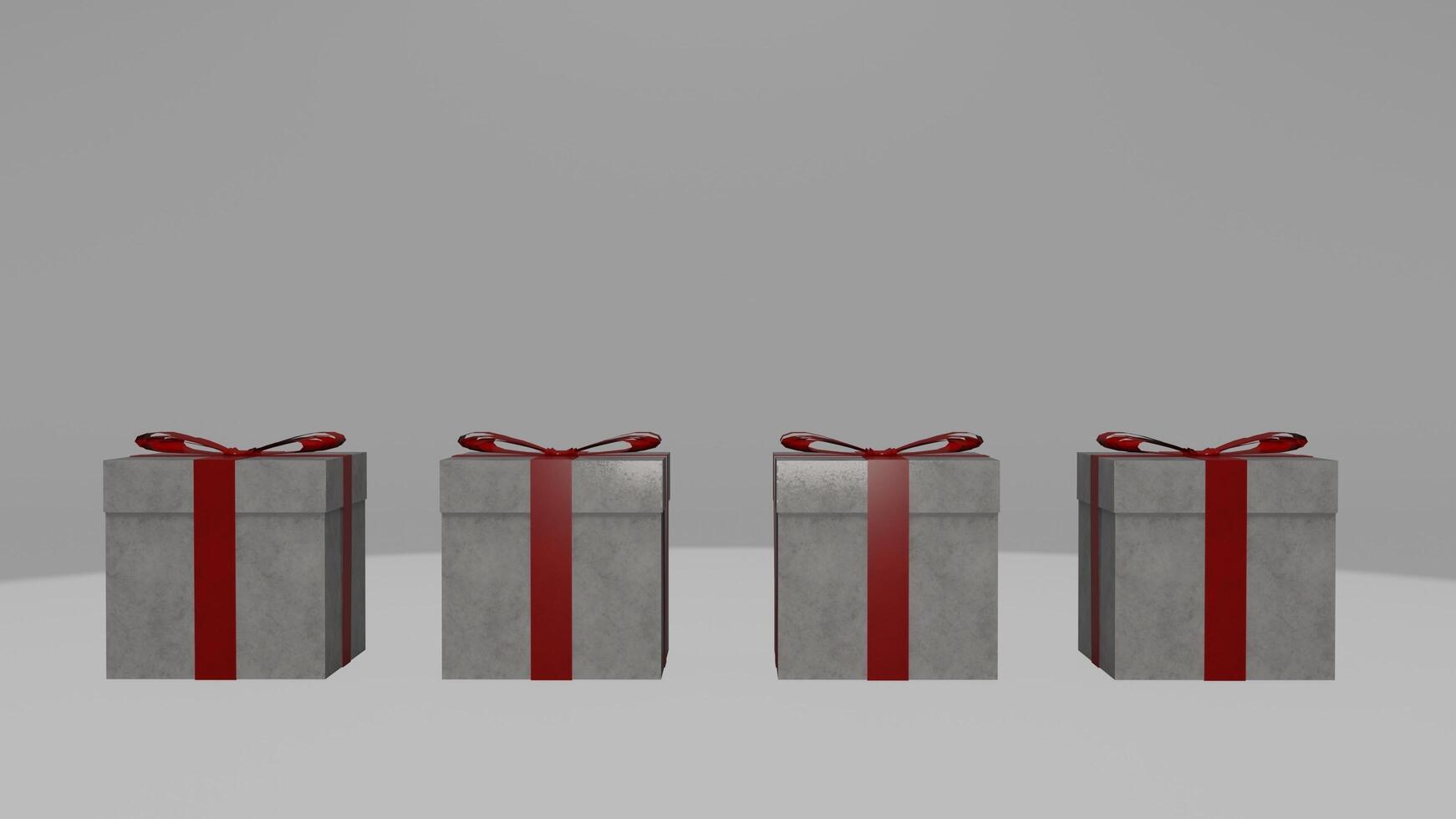 Three gift boxes with red bows on top of each other photo
